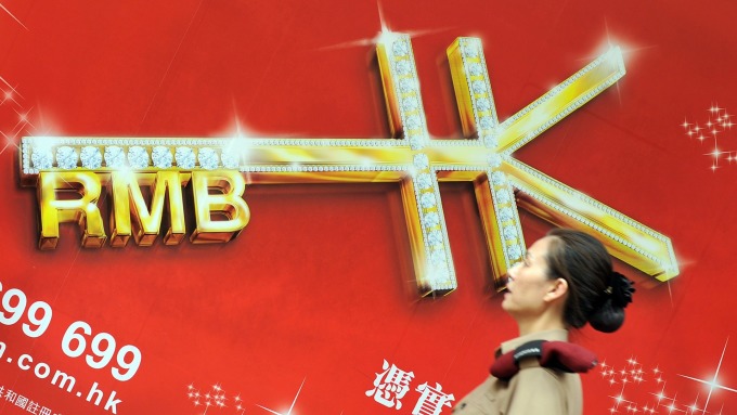 人民幣昨晚急跌沖破6.88 距6.9大關僅一步之遙
