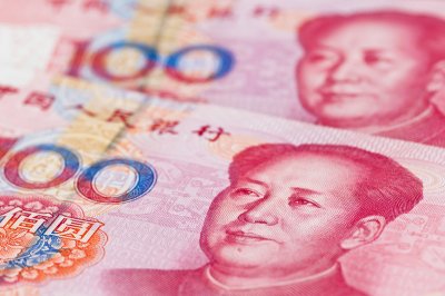 人民幣早盤隨中間價縮量微跌 